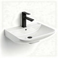 Wall-mounted ceramic sink with black faucet 60 x 40 x 15cm